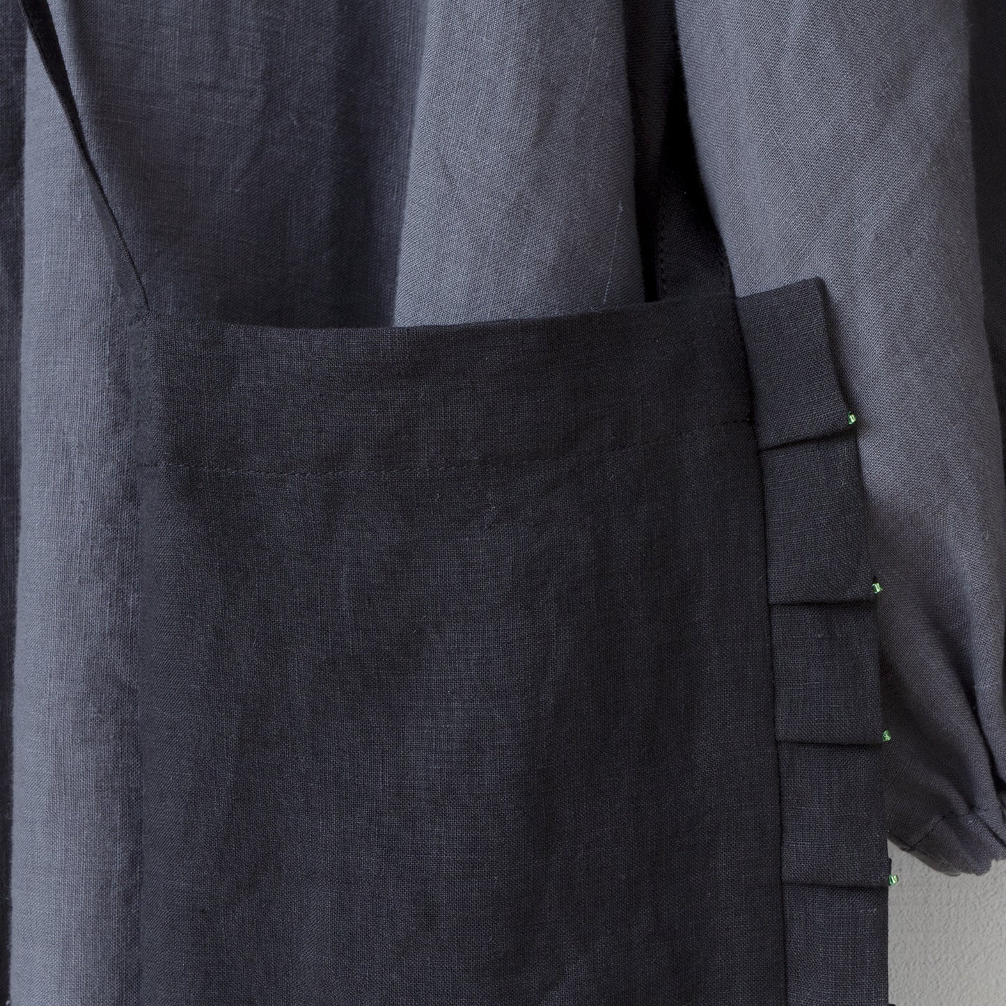 Linen pochette with tuck frills and beads