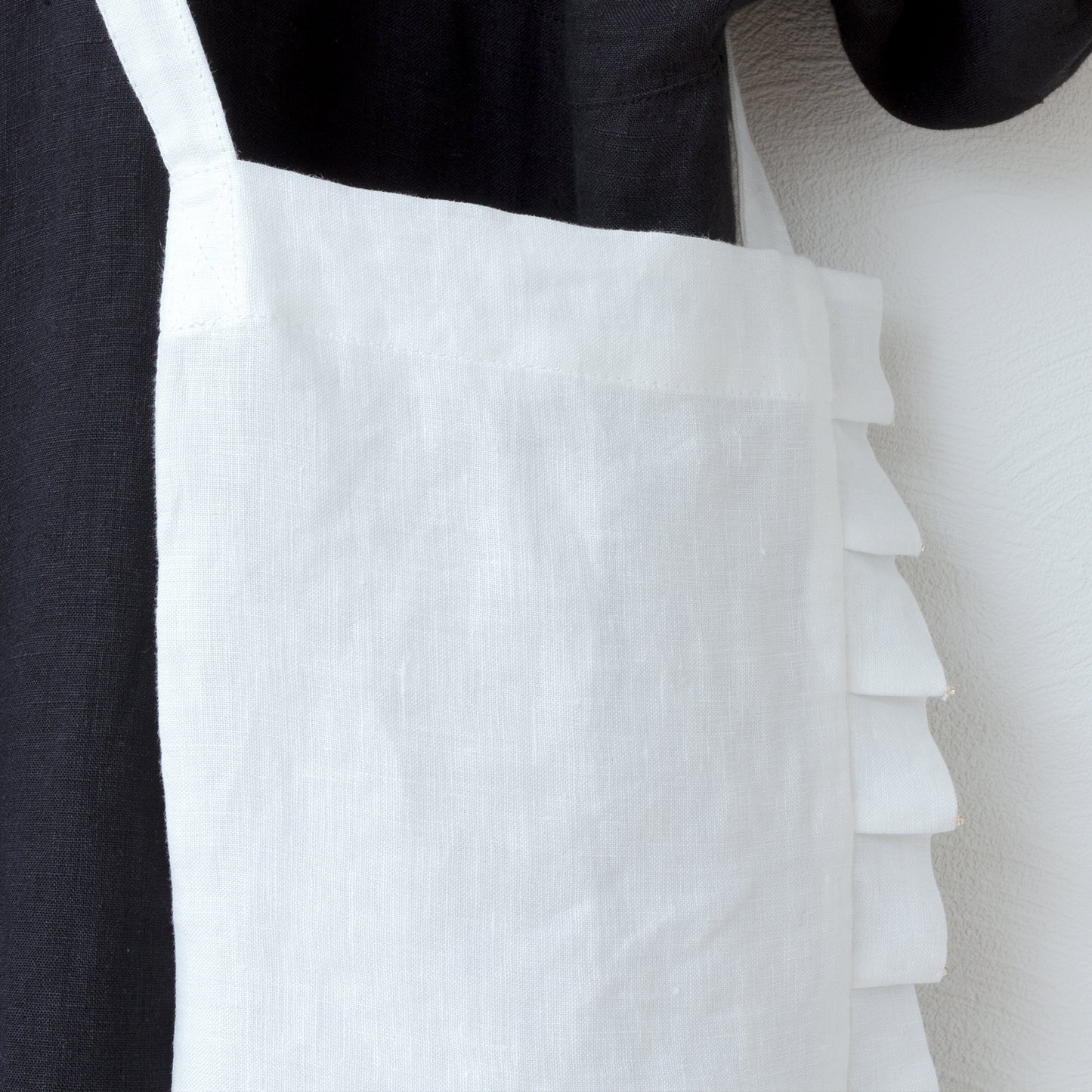 Linen pochette with tuck frills and beads