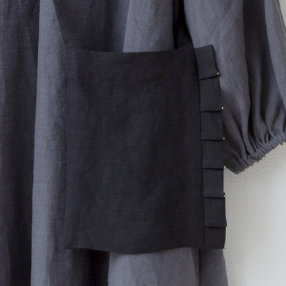 Linen pochette with tuck frills and beads